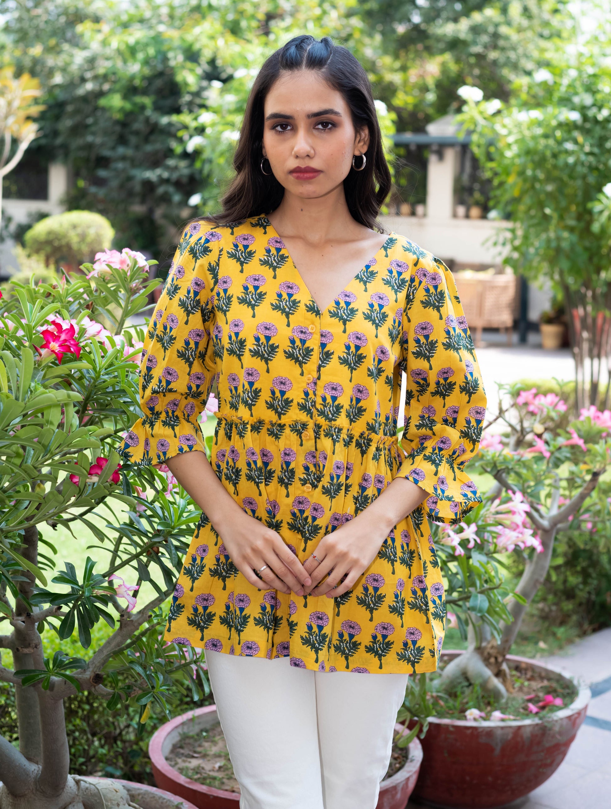Yellow Floral Peplum Top with V-Neckline