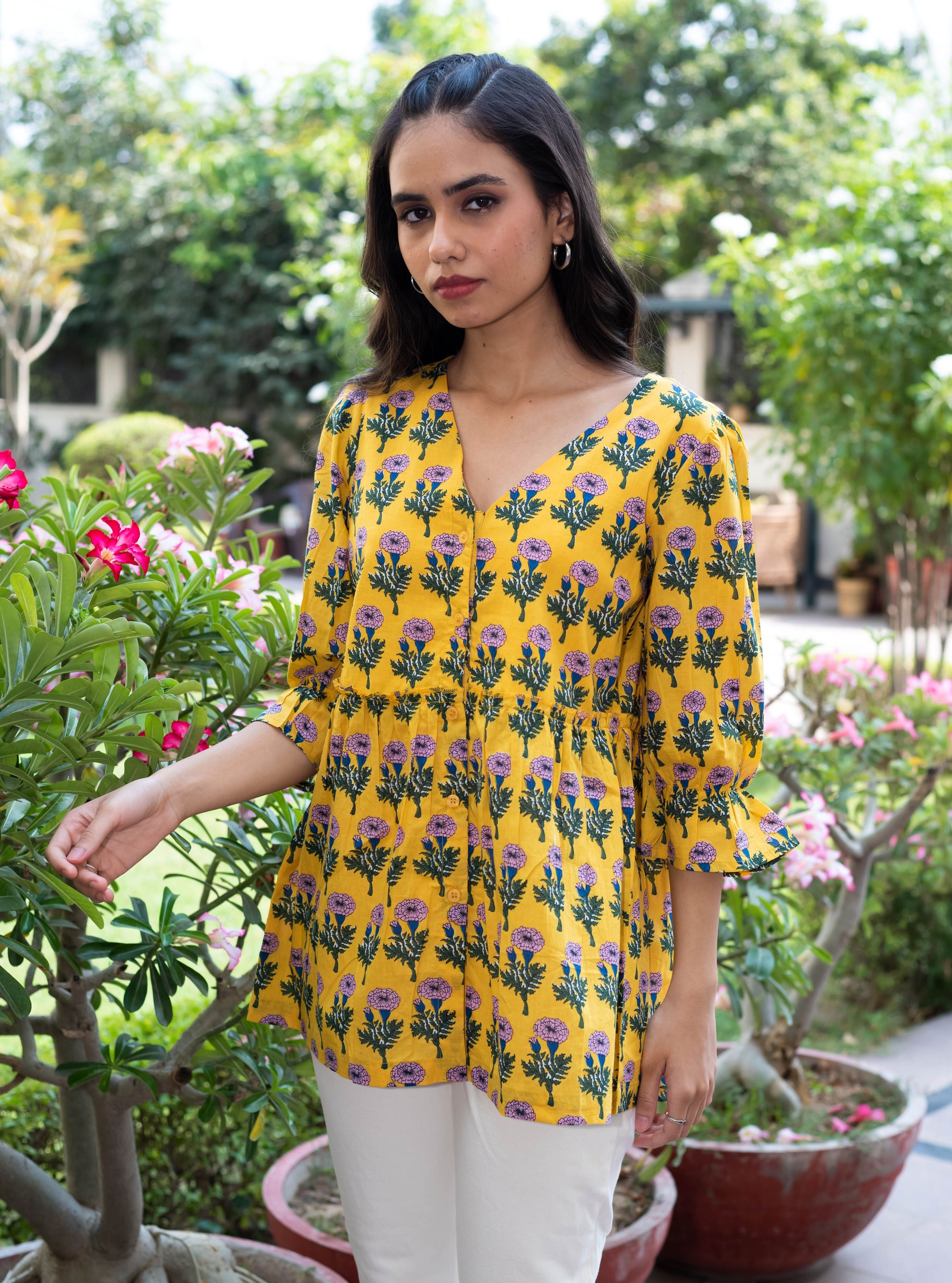 Yellow Floral Peplum Top with V-Neckline